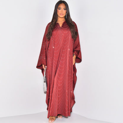 red diamond abaya dress The stunning red Emirati abaya adorned with diamonds, paired with a matching inner and a diamond-accented hijab, makes the perfect outfit for any celebration Khaleeji abaya fashion, abaya lovers, eid abaya, abaya